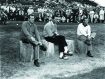 Arnold Palmer sitting with two men on a golf course at Pebble Beach