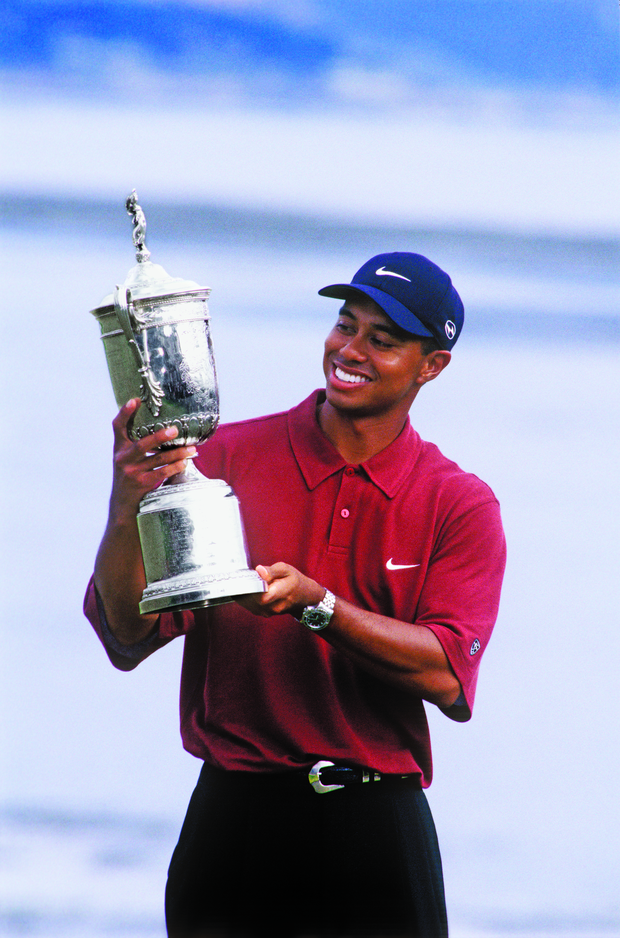 tiger_woods_with_trophy_1_c_pebble_beach_company_edit